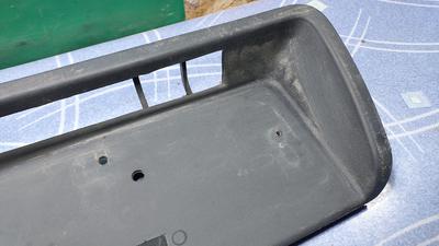 Накладка бампера под номерной знак G7 TOYOTA Hilux 52179-0K010
